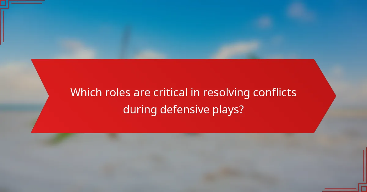 Which roles are critical in resolving conflicts during defensive plays?
